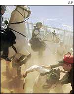 Australian mounted police tackle protesters 